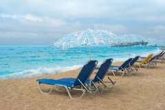 Beach with Arranged Beach Chairs and Umbrellas  - High-quality free Photo from FreeArtBackgrounds.com