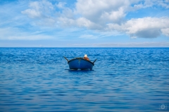 Fisherman in Small Boat in the Sea Background - High-quality free Photo from FreeArtBackgrounds.com
