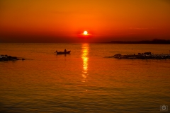 Sunrise with Boat and Fisherman Background - High-quality free Photo from FreeArtBackgrounds.com